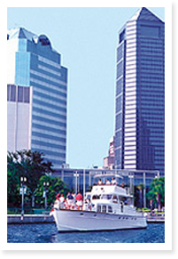 Picture of boat in front of Downtown Jacksonville buildings